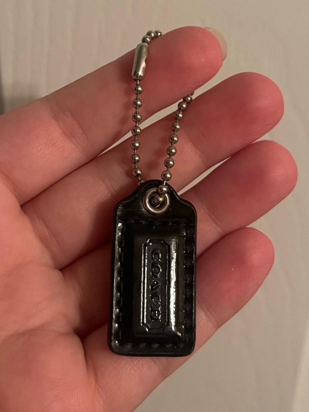 Black coach hangtag